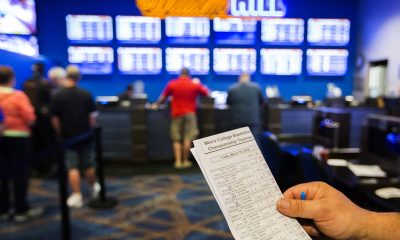 William Hill lowers profit forecast