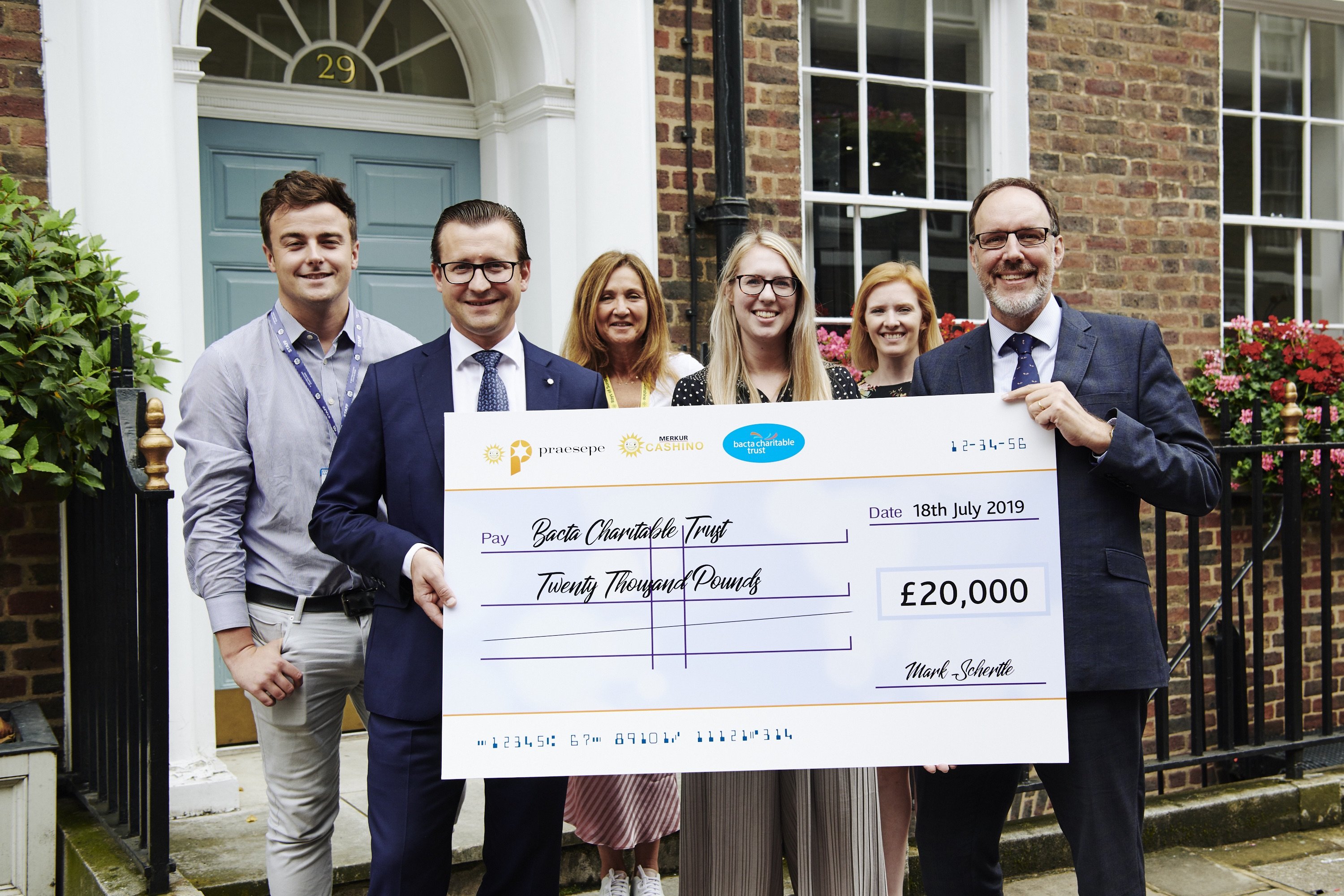 Merkur celebrate fantastic support for bacta Charitable Trust with a smile